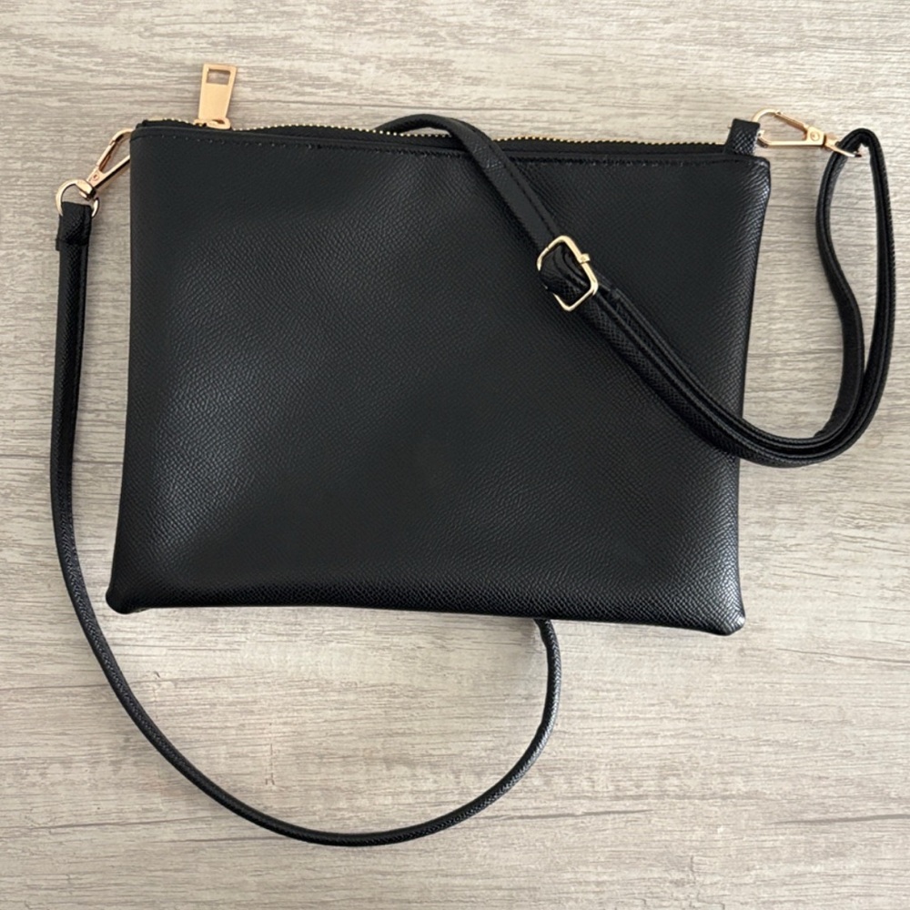 Elegant Black Crossbody Bag with Gold Accents